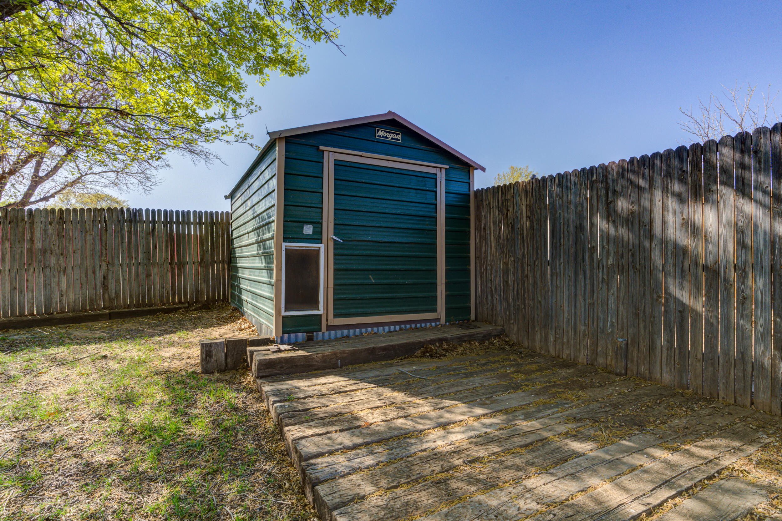 7106 Zoar Avenue Lubbock, TX 79424 - Photo 33 of 33 a backyard of a house with a tree