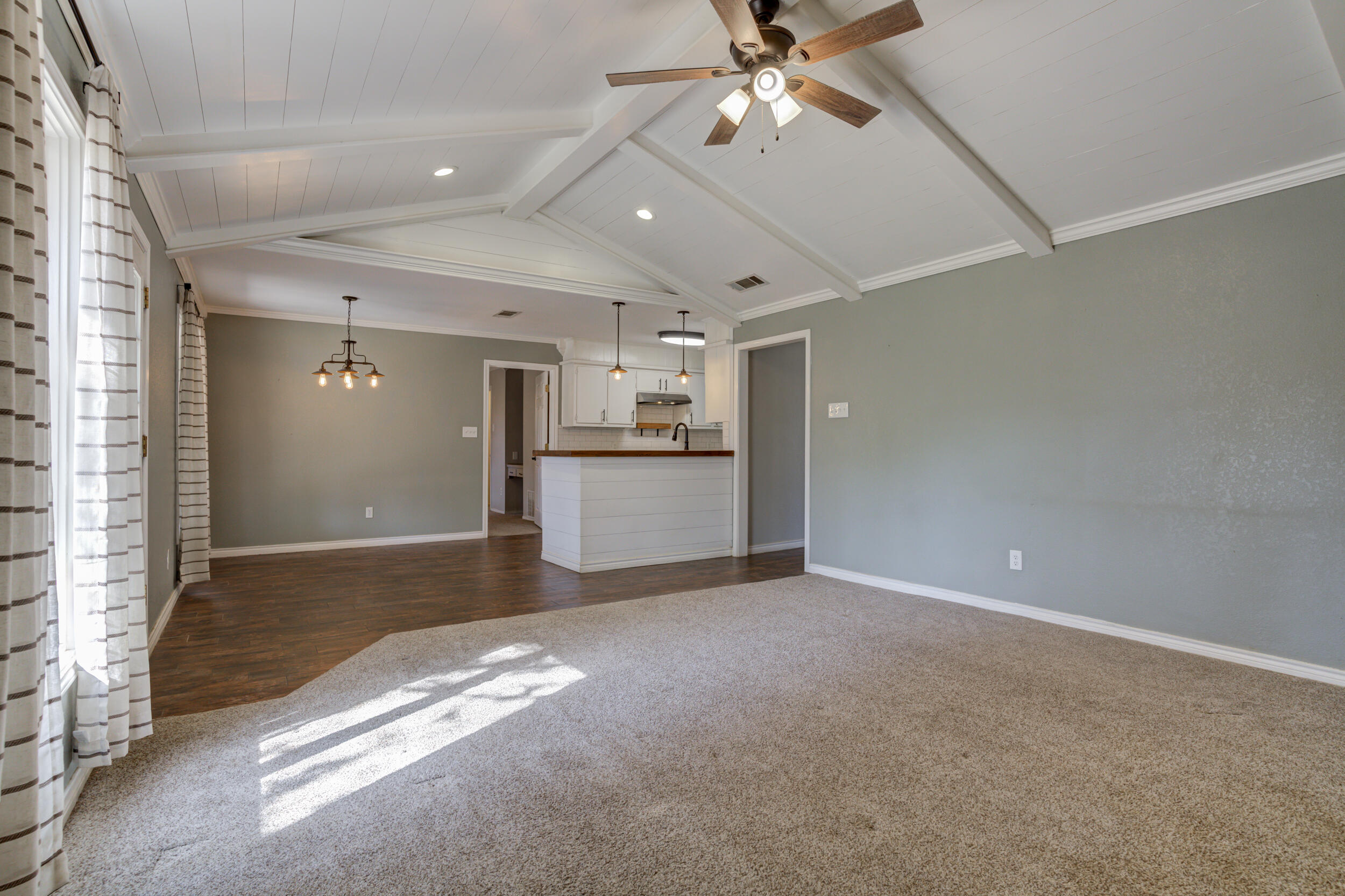 7106 Zoar Avenue Lubbock, TX 79424 - Photo 7 of 33 a view of a kitchen with a sink and cabinet area