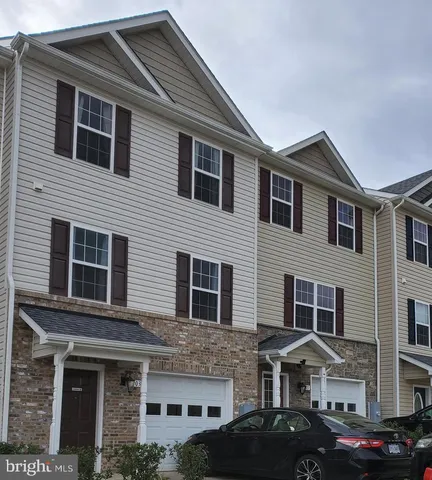 a front view of a house with yard