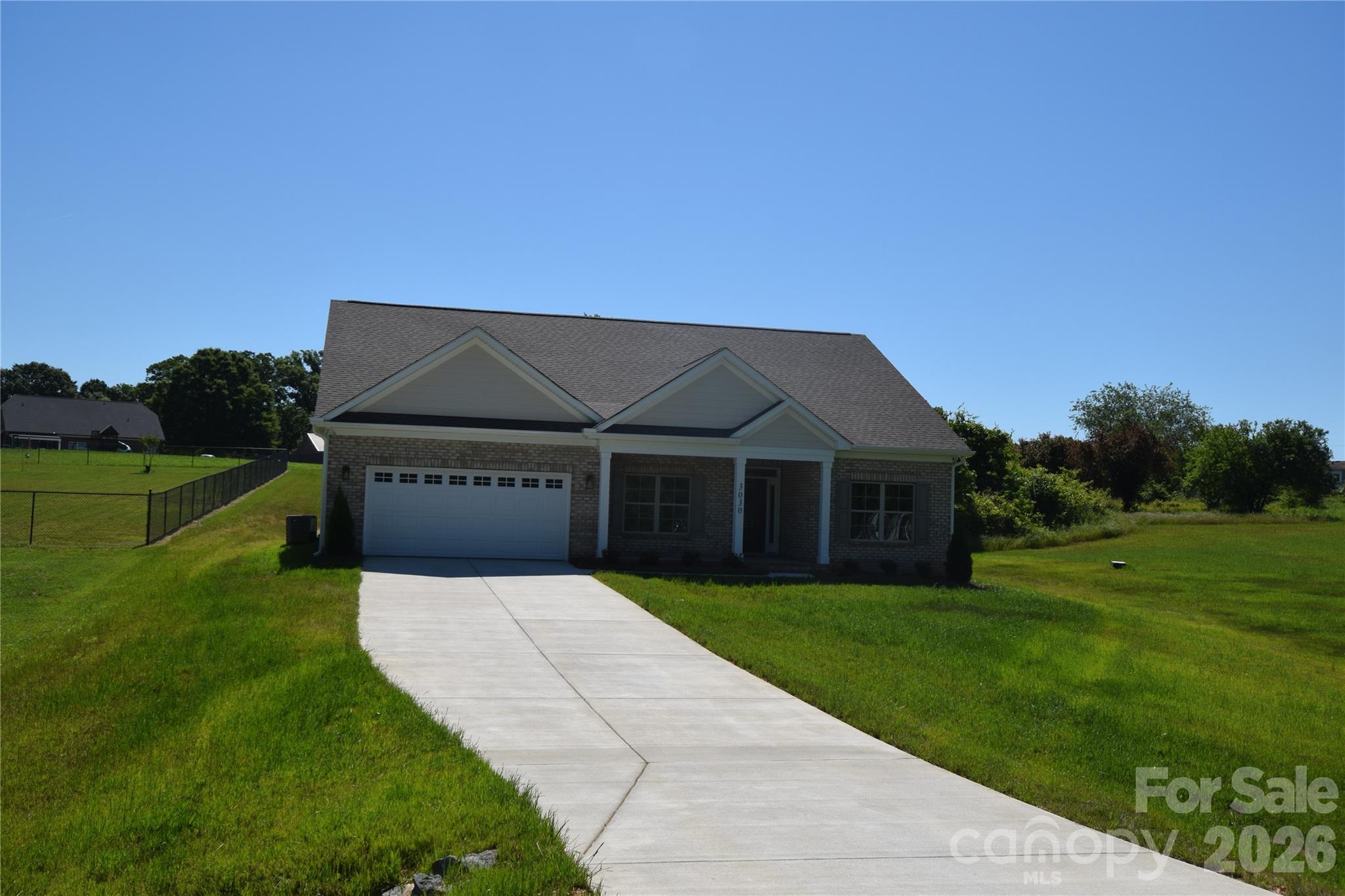 3030 Buffett Lane, Unit 49 Monroe, NC 28110 - Photo 31 of 31 a front view of a house with a yard