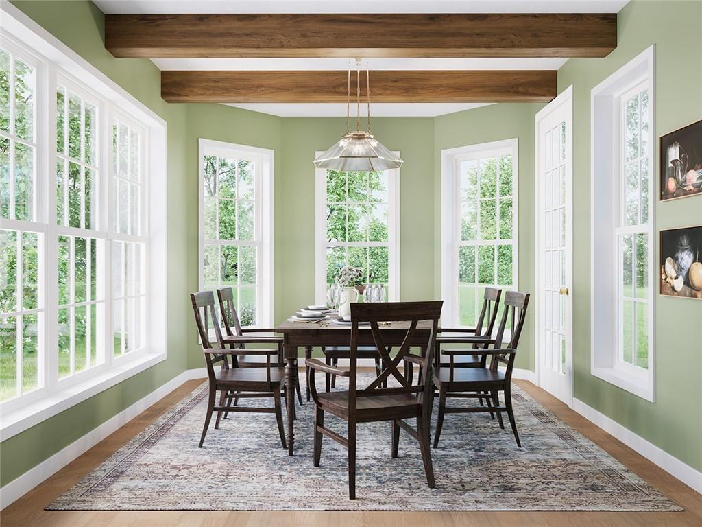 102 Ramsgate Road, Unit ARUNDEL Cranberry Township, PA 16066 - Photo 5 of 27 a view of a dining room with furniture window and wooden floor