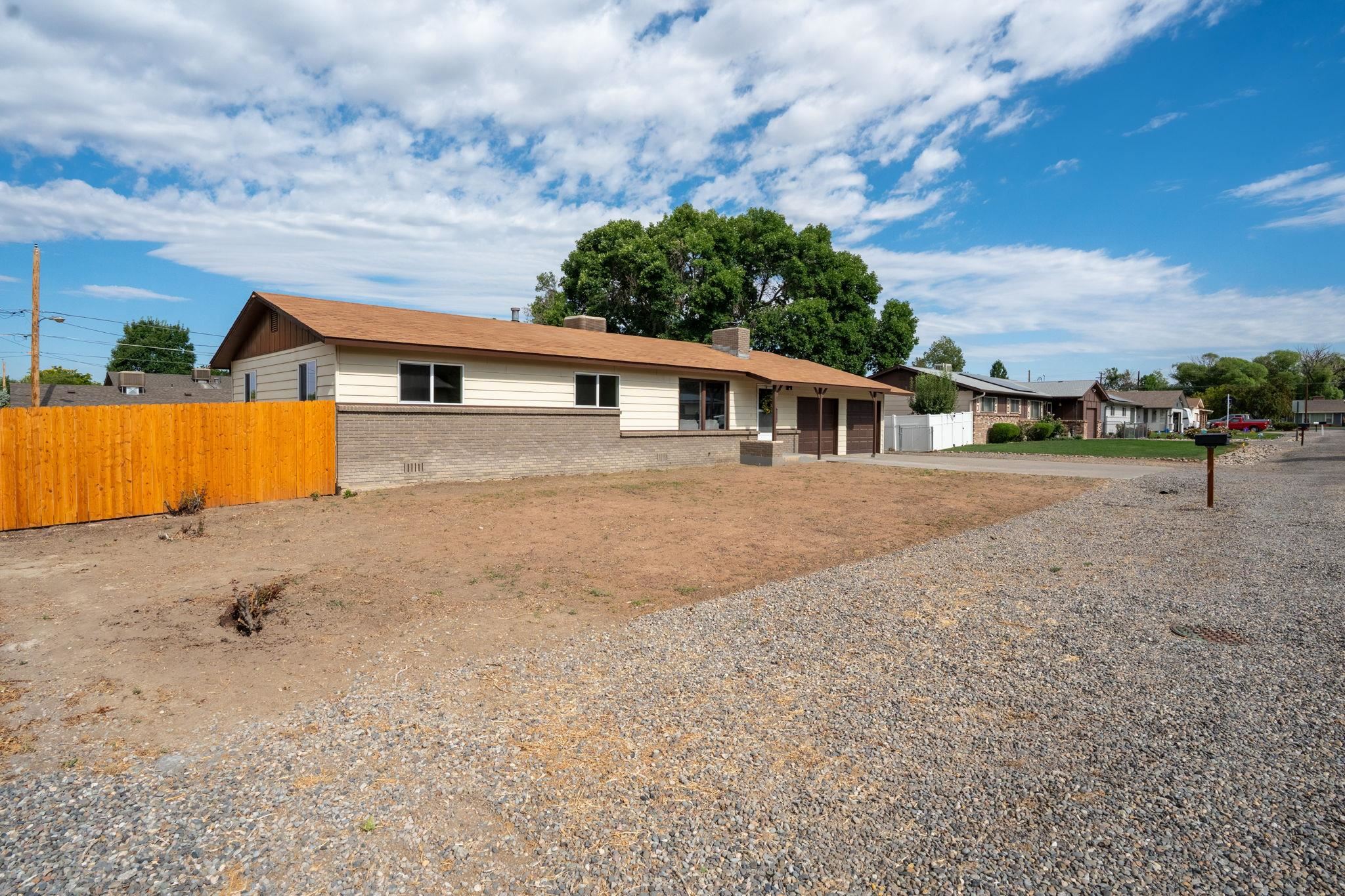 543 Dodge Street Grand Junction, CO 81504 - Photo 1 of 19 a view of a house with a backyard