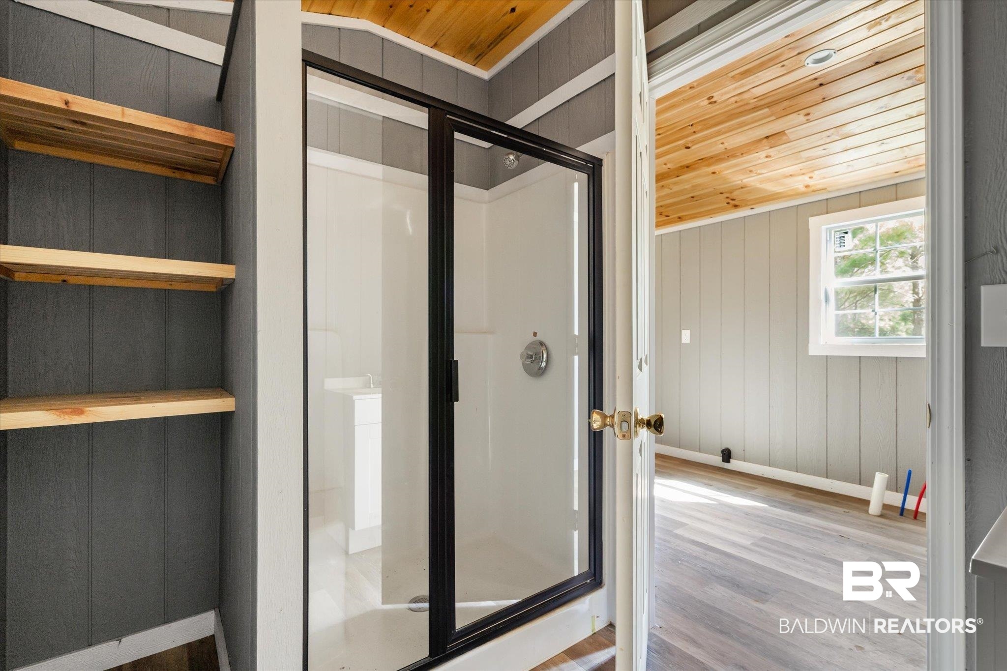 15685 Louis Cooper Road Bay Minette, AL 36507 - Photo 26 of 26 Bathroom featuring wood walls, wooden ceiling, and wood-type flooring