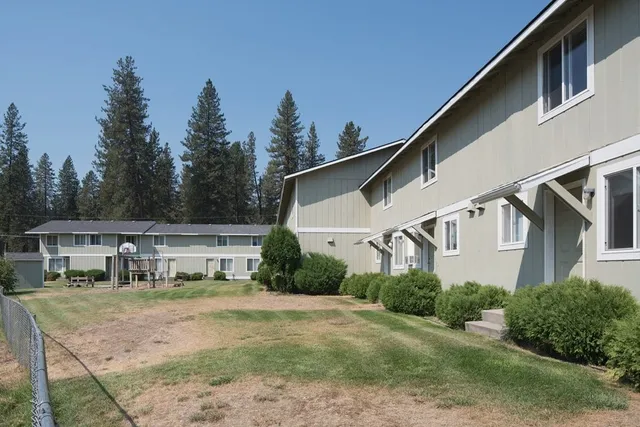 a house with trees in the background