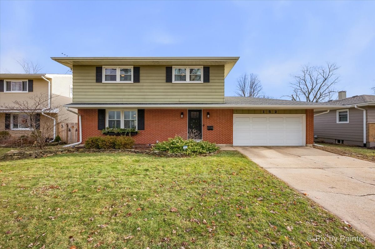 152 Walnut Drive St. Charles, IL 60174 - Photo 1 of 30 a front view of a house with garden