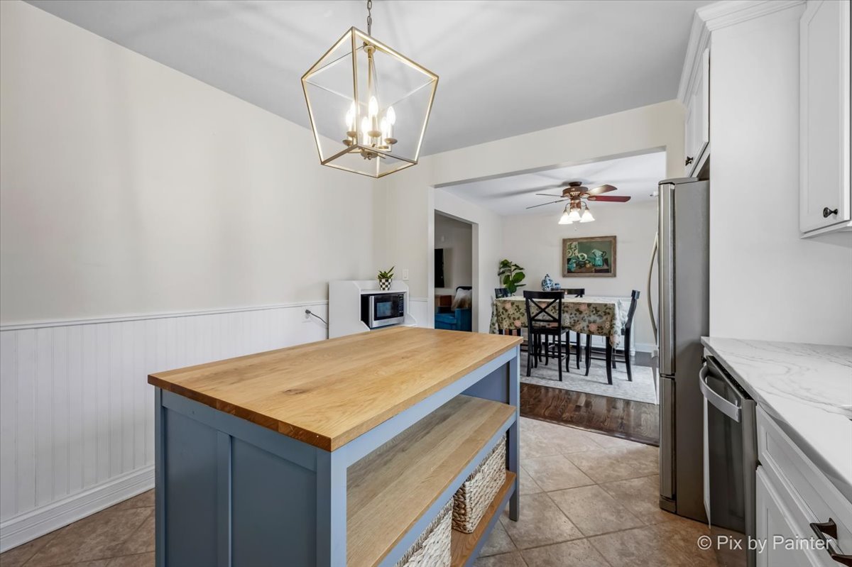 152 Walnut Drive St. Charles, IL 60174 - Photo 11 of 30 a view of a dining room with furniture and chandelier