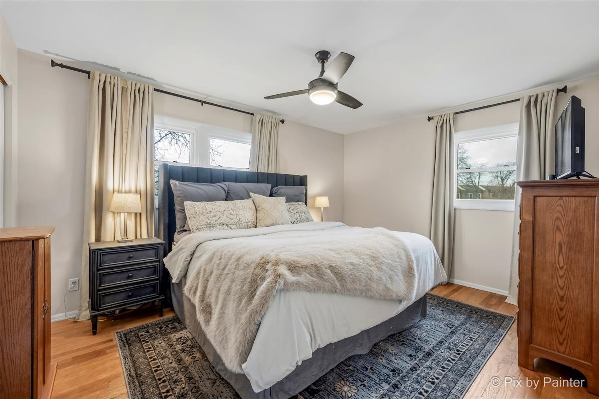 152 Walnut Drive St. Charles, IL 60174 - Photo 15 of 30 a bedroom with a bed and wooden floor