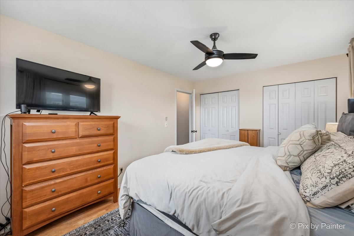 152 Walnut Drive St. Charles, IL 60174 - Photo 16 of 30 a bedroom with a bed and a flat screen tv