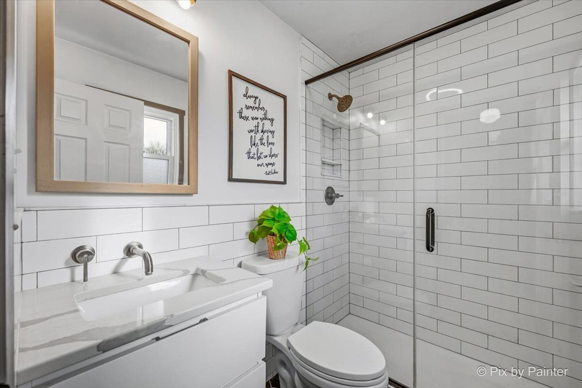 152 Walnut Drive St. Charles, IL 60174 - Photo 21 of 30 a bathroom with a sink a toilet and shower
