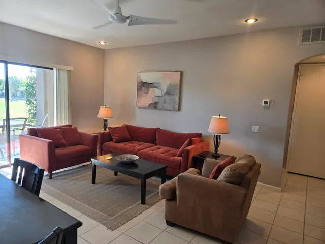 a living room with furniture and a window