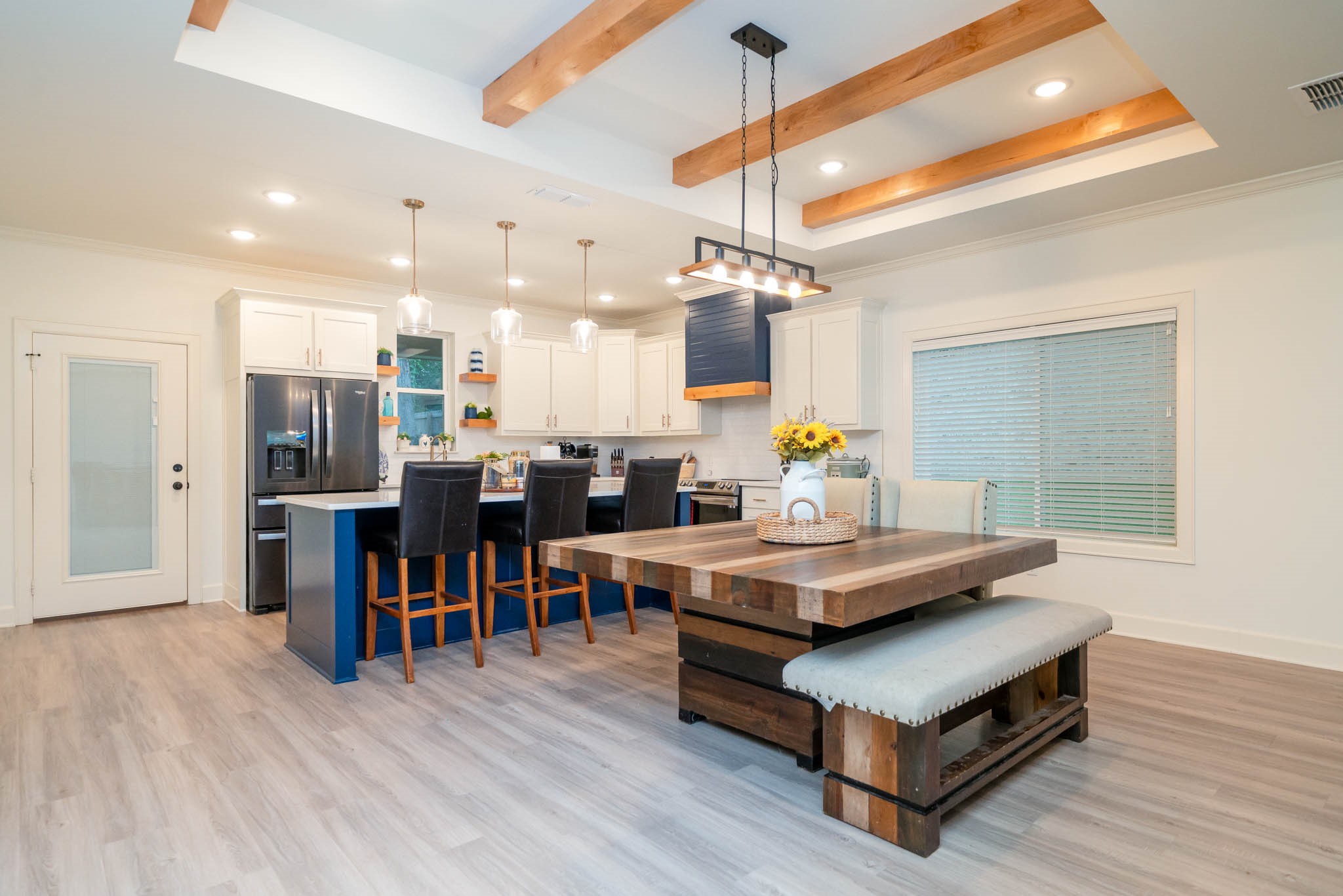 113 West Ruth Street White Oak, TX 75693 - Photo 14 of 27 a living room with stainless steel appliances kitchen island a table and chairs