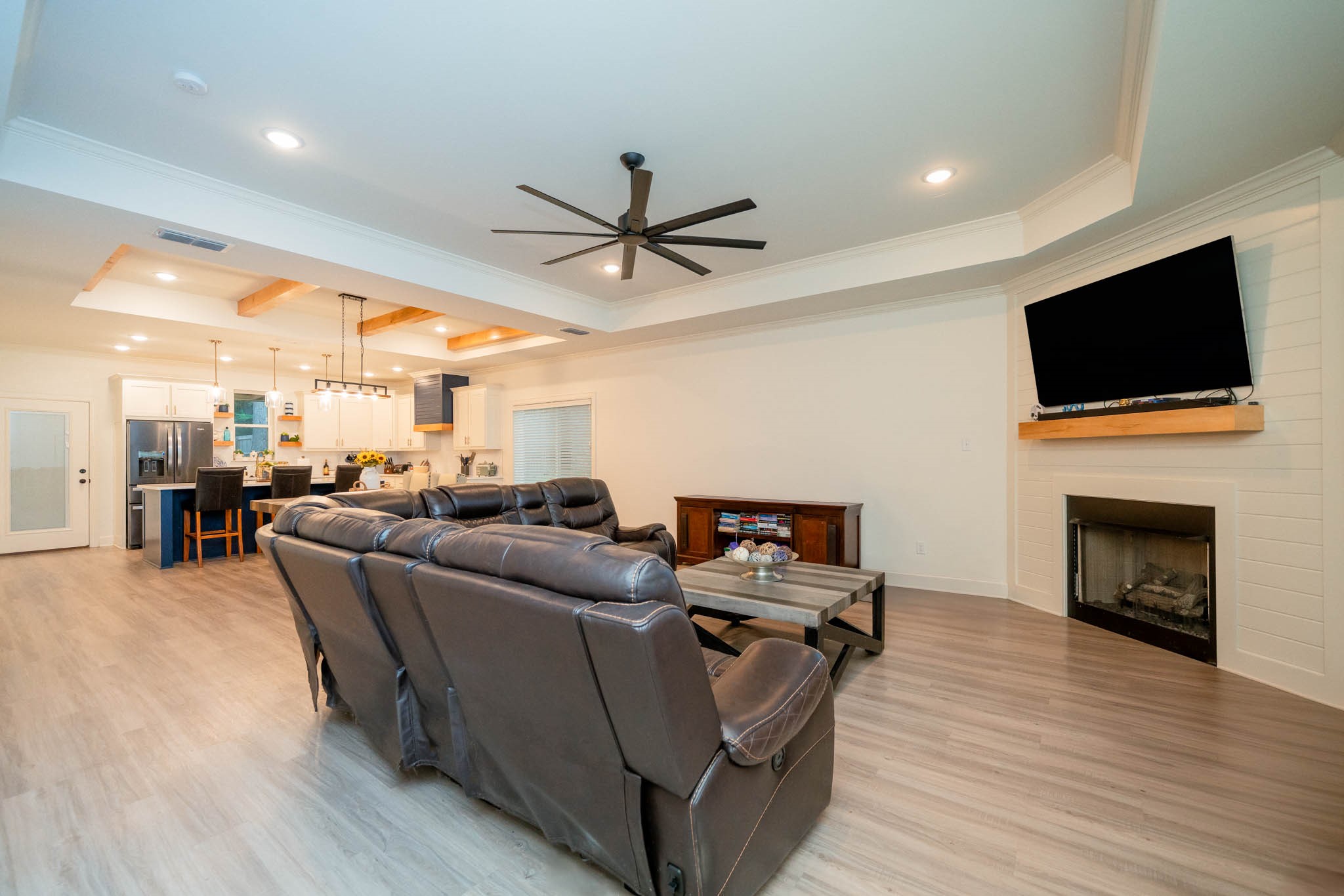 113 West Ruth Street White Oak, TX 75693 - Photo 4 of 27 a living room with furniture a fireplace and a flat screen tv