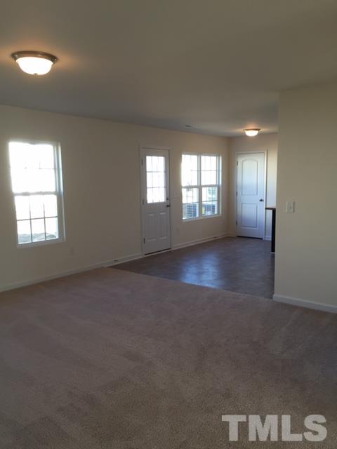 3908 Mike Levi Court Raleigh, NC 27610 - Photo 4 of 10 an empty room with windows