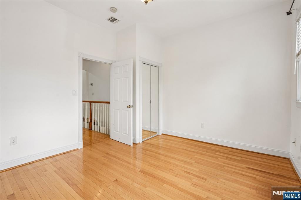 90 A Hackensack Plank Road Weehawken, NJ 07086 - Photo 23 of 40 a view of an empty room with wooden floor