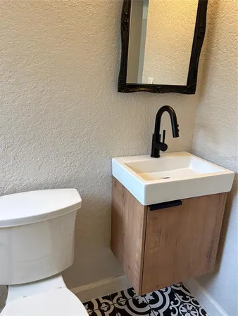 a bathroom with a sink and a toilet