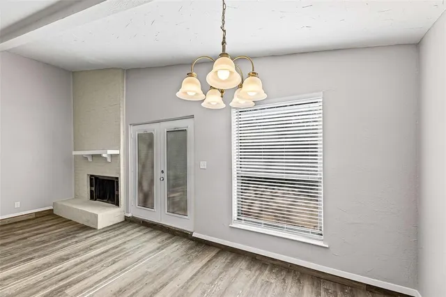 a kitchen with granite countertop a sink a counter space and cabinets