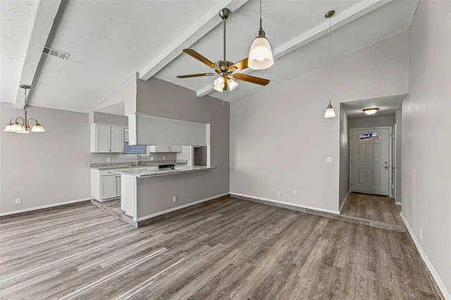 wooden floor in an empty room with a fireplace