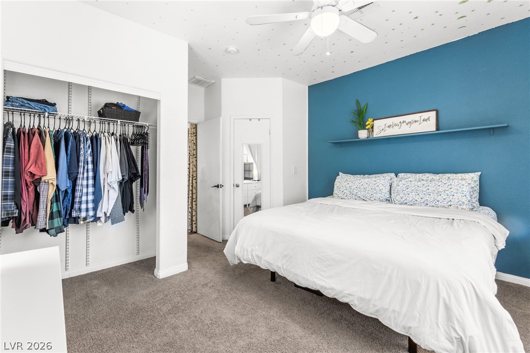 7353 Ridge Star Court Las Vegas, NV 89131 - Photo 29 of 36 A well-appointed bedroom features ample closet space and plush carpeting for comfort.