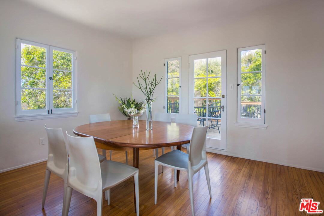 4541 Round Top Drive Los Angeles, CA 90065 - Photo 14 of 40 a view of a dining room with furniture window and wooden floor