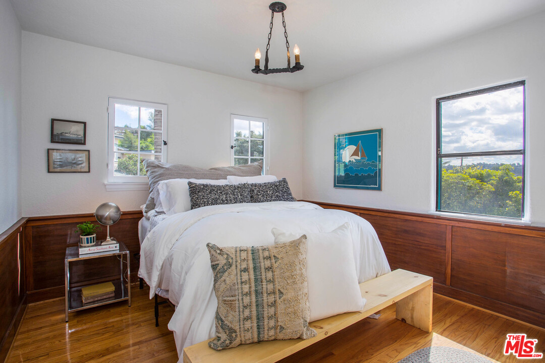 4541 Round Top Drive Los Angeles, CA 90065 - Photo 15 of 40 a bed sitting in a bedroom next to a window