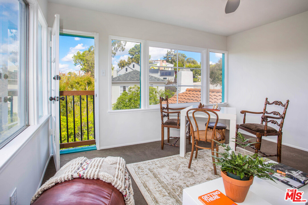 4541 Round Top Drive Los Angeles, CA 90065 - Photo 18 of 40 a bedroom with a bed and a table