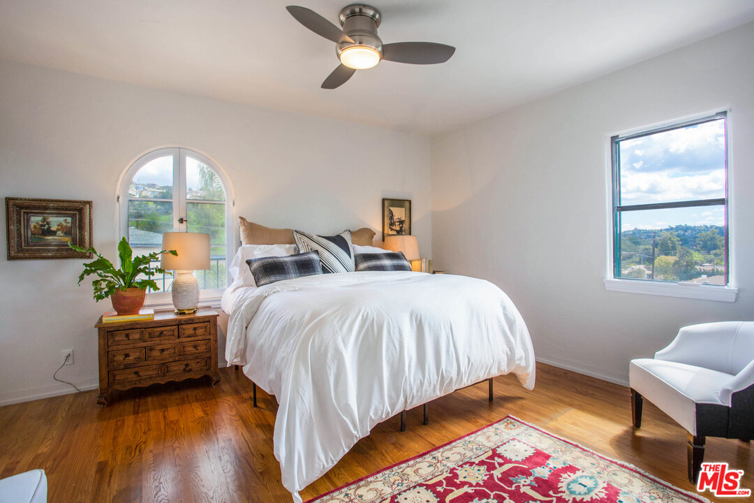4541 Round Top Drive Los Angeles, CA 90065 - Photo 22 of 40 a bedroom with a bed and a window