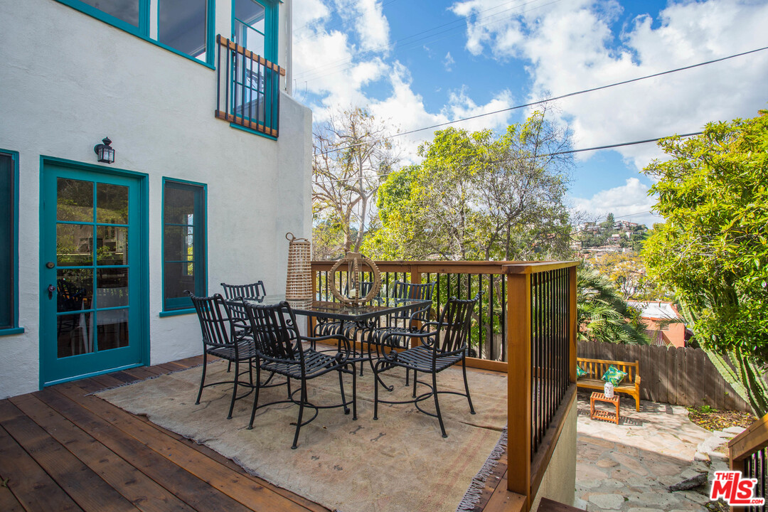 4541 Round Top Drive Los Angeles, CA 90065 - Photo 24 of 40 a view of a patio with table and chairs and potted plants