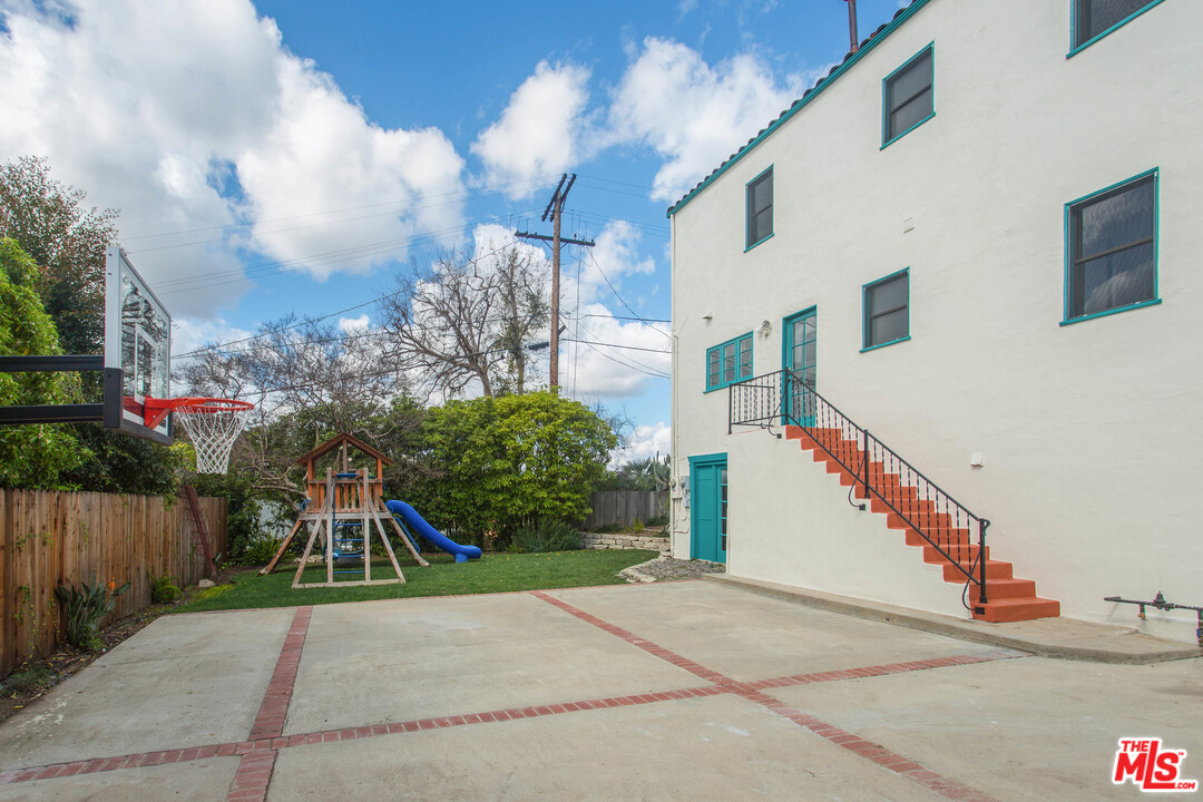 4541 Round Top Drive Los Angeles, CA 90065 - Photo 30 of 40 a view of a house with a yard and potted plants