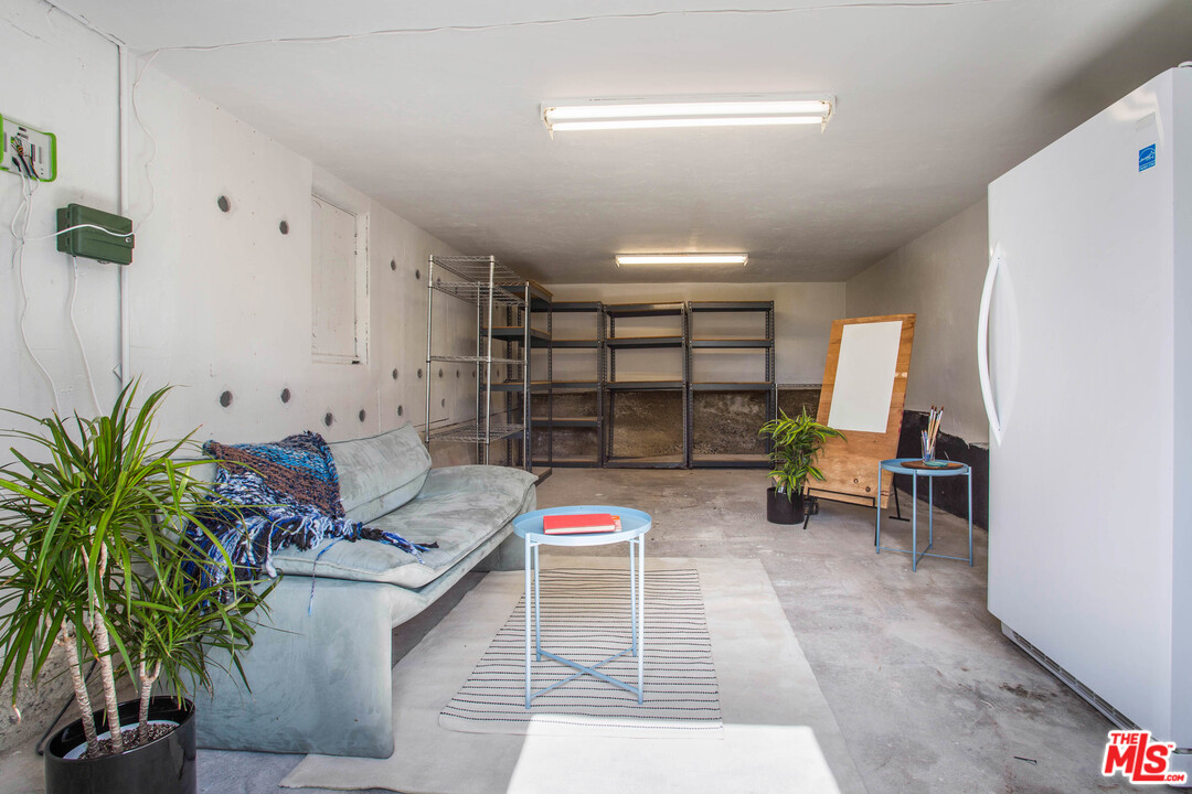 4541 Round Top Drive Los Angeles, CA 90065 - Photo 31 of 40 a living room with furniture a potted plant and a table