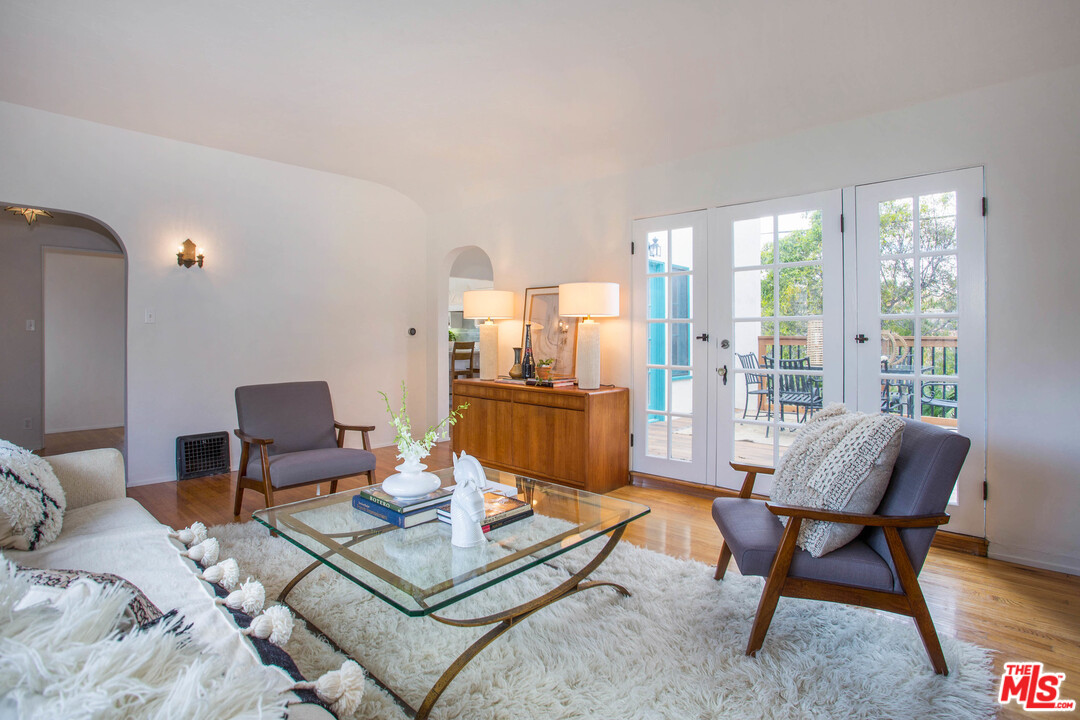 4541 Round Top Drive Los Angeles, CA 90065 - Photo 6 of 40 a living room with furniture a rug and a floor to ceiling window