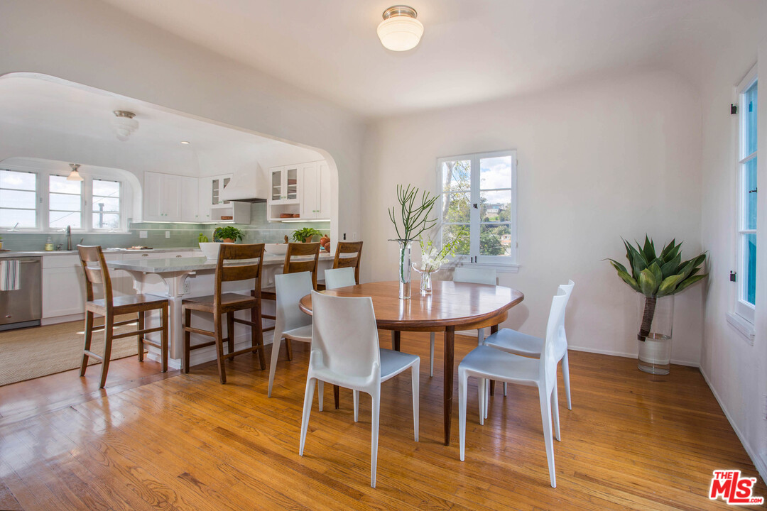 4541 Round Top Drive Los Angeles, CA 90065 - Photo 9 of 40 a view of a dining room with furniture and wooden floor