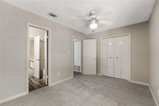 a view of an empty room with a fan