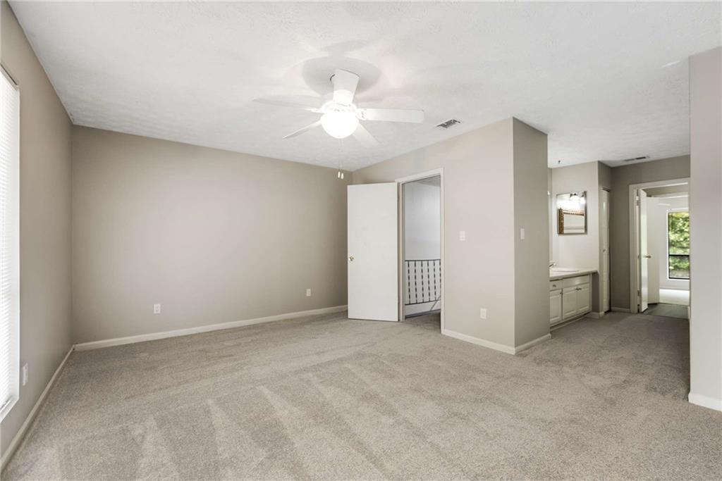 6170 Woodland Road Northwest Peachtree Corners, GA 30092 - Photo 19 of 27 a view of an empty room with a window