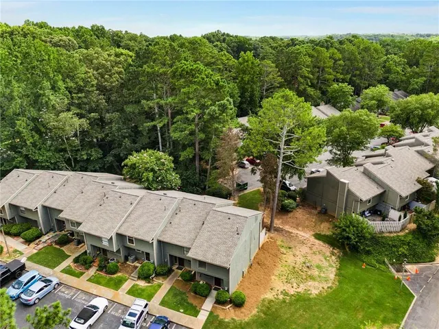 an aerial view of a house with a yard