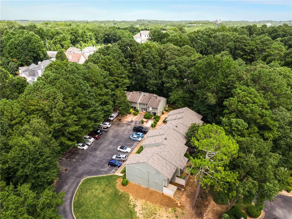 6170 Woodland Road Northwest Peachtree Corners, GA 30092 - Photo 26 of 27 an aerial view of a house with a yard