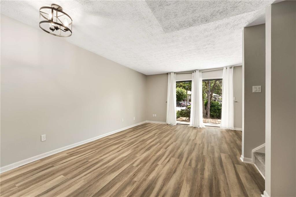 6170 Woodland Road Northwest Peachtree Corners, GA 30092 - Photo 5 of 27 a view of an empty room with a window