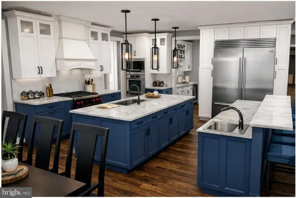 a kitchen with a sink stove and refrigerator