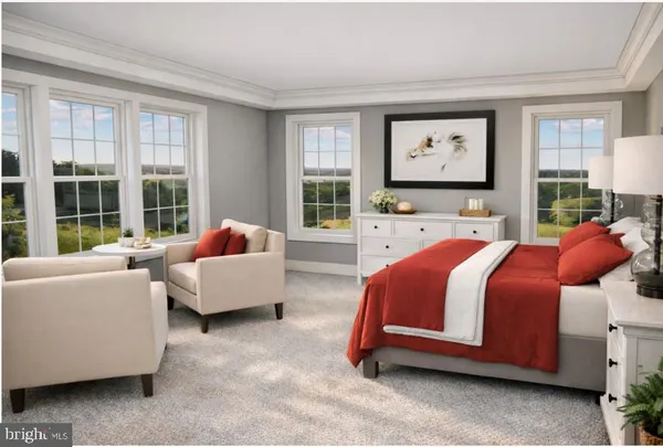 a spacious bedroom with a bed and glass windows