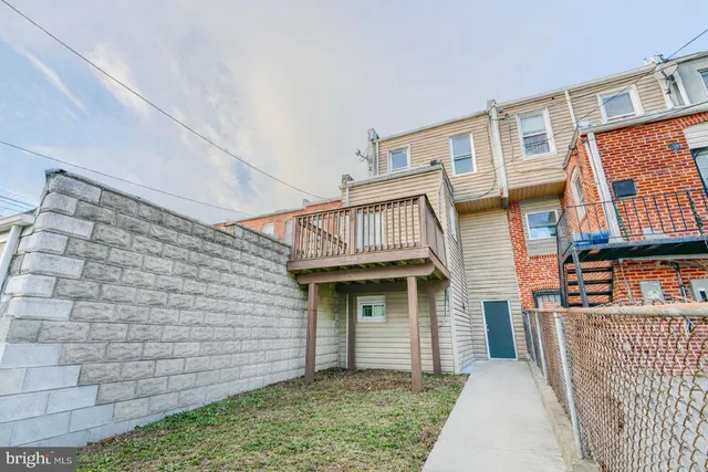 a view of front of a house with a balcony