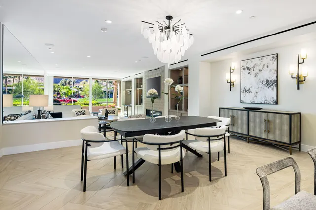 a view of a room with furniture and a chandelier