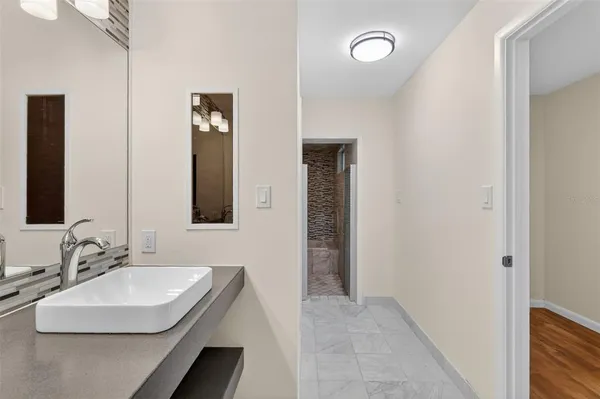 a bathroom with a sink and a mirror