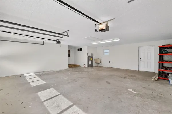 a swimming pool with trees in the background