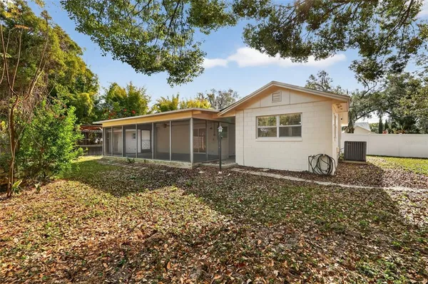 a view of house with a garden
