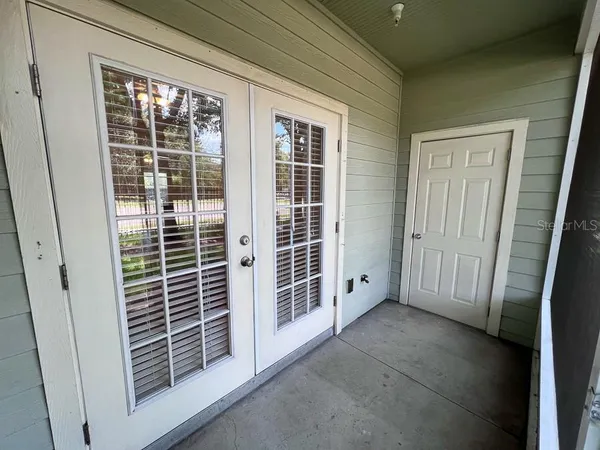 a view of empty room with windows