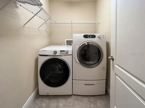 a utility room with dryer and washer