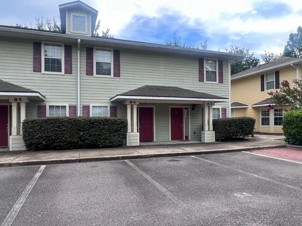 a front view of a house with yard