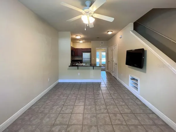 a view of a livingroom with furniture and a flat screen tv