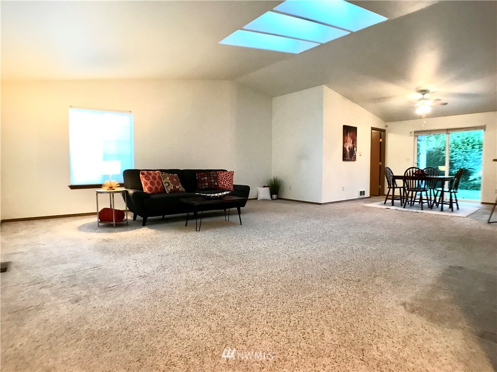6018 Prather Road Southwest Centralia, WA 98531 - Photo 12 of 28 a living room with furniture and a table