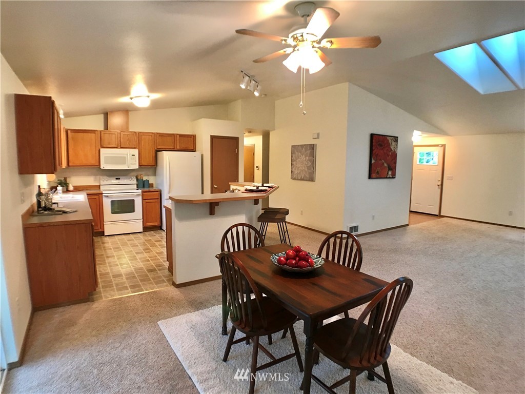 6018 Prather Road Southwest Centralia, WA 98531 - Photo 14 of 28 a view of a dining room with furniture and a chandelier