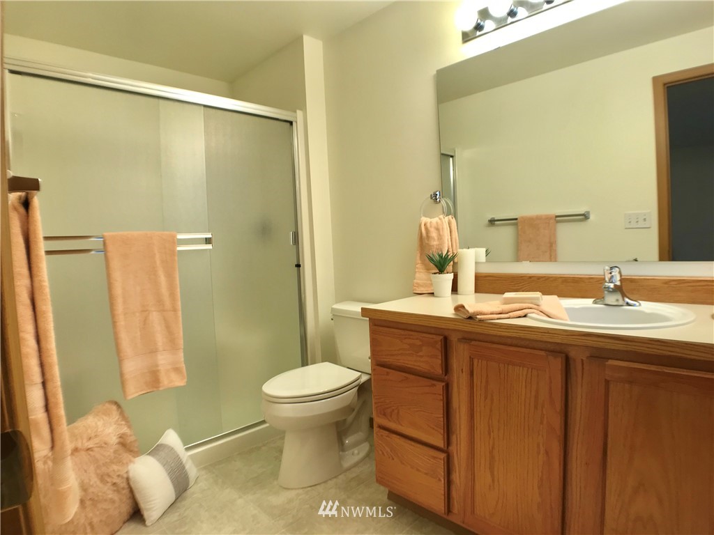 6018 Prather Road Southwest Centralia, WA 98531 - Photo 21 of 28 a bathroom with a granite countertop sink toilet and shower